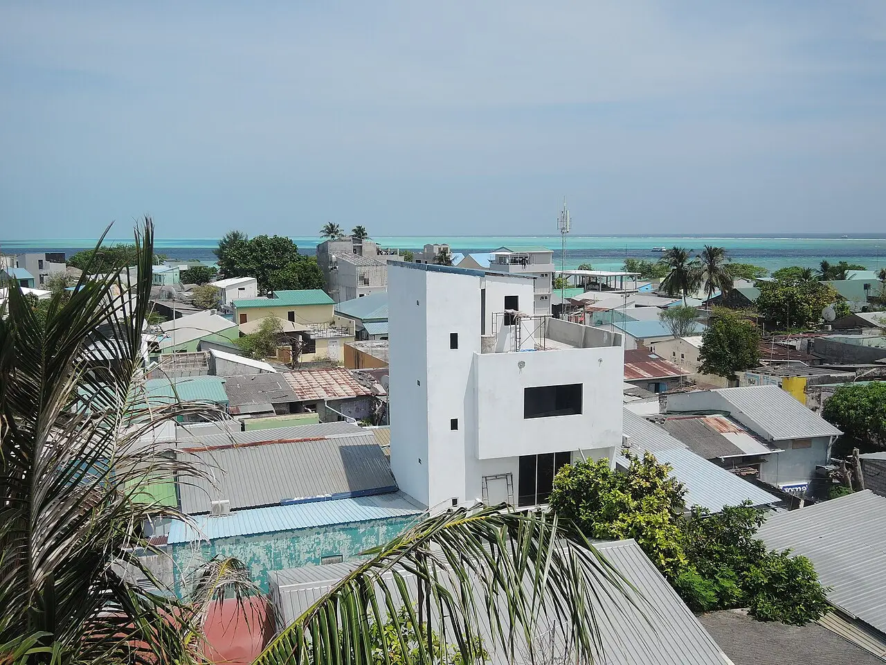 Rooftop view over the houses of Gulhi with the lagoon and sea on the horizon
